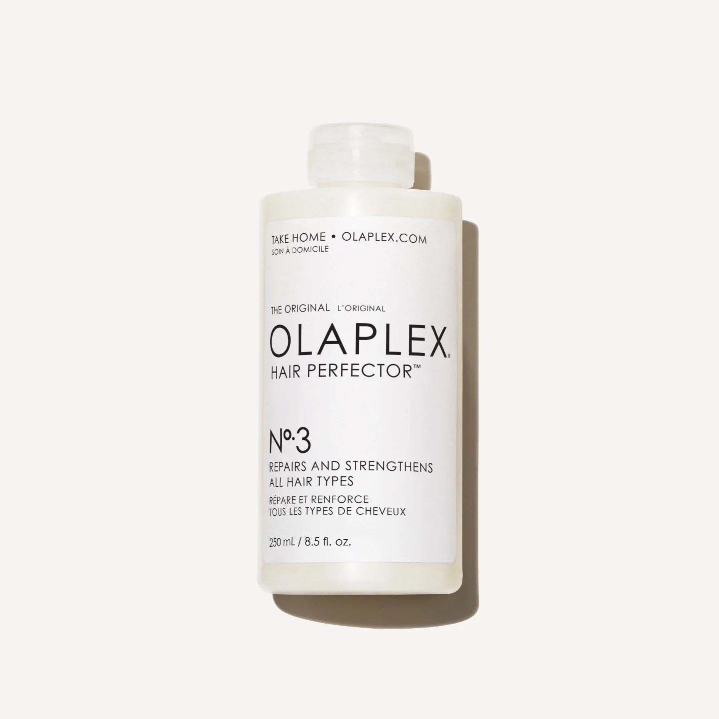 A bottle of Olaplex No.3 Hair Perfector, also known as a bond builder, designed to strengthen and repair hair.