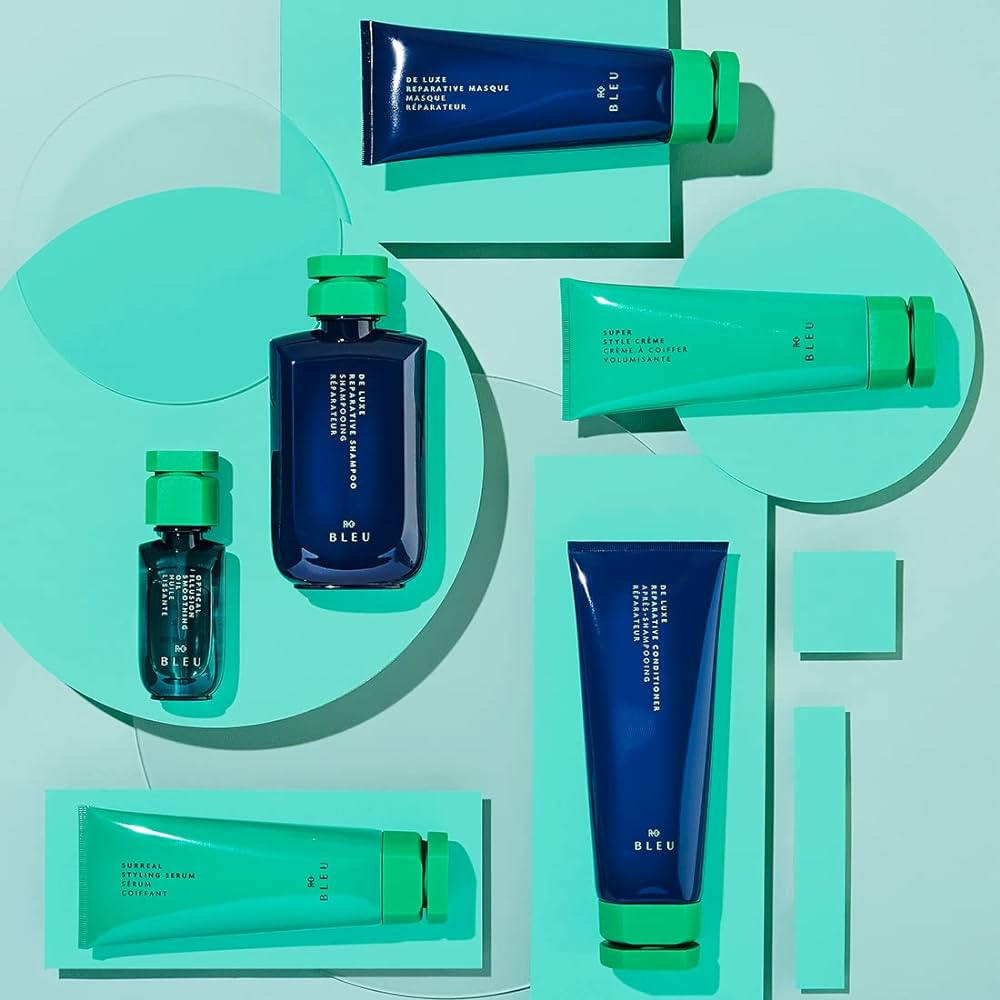 Collection of blue and green skincare products on a light blue background