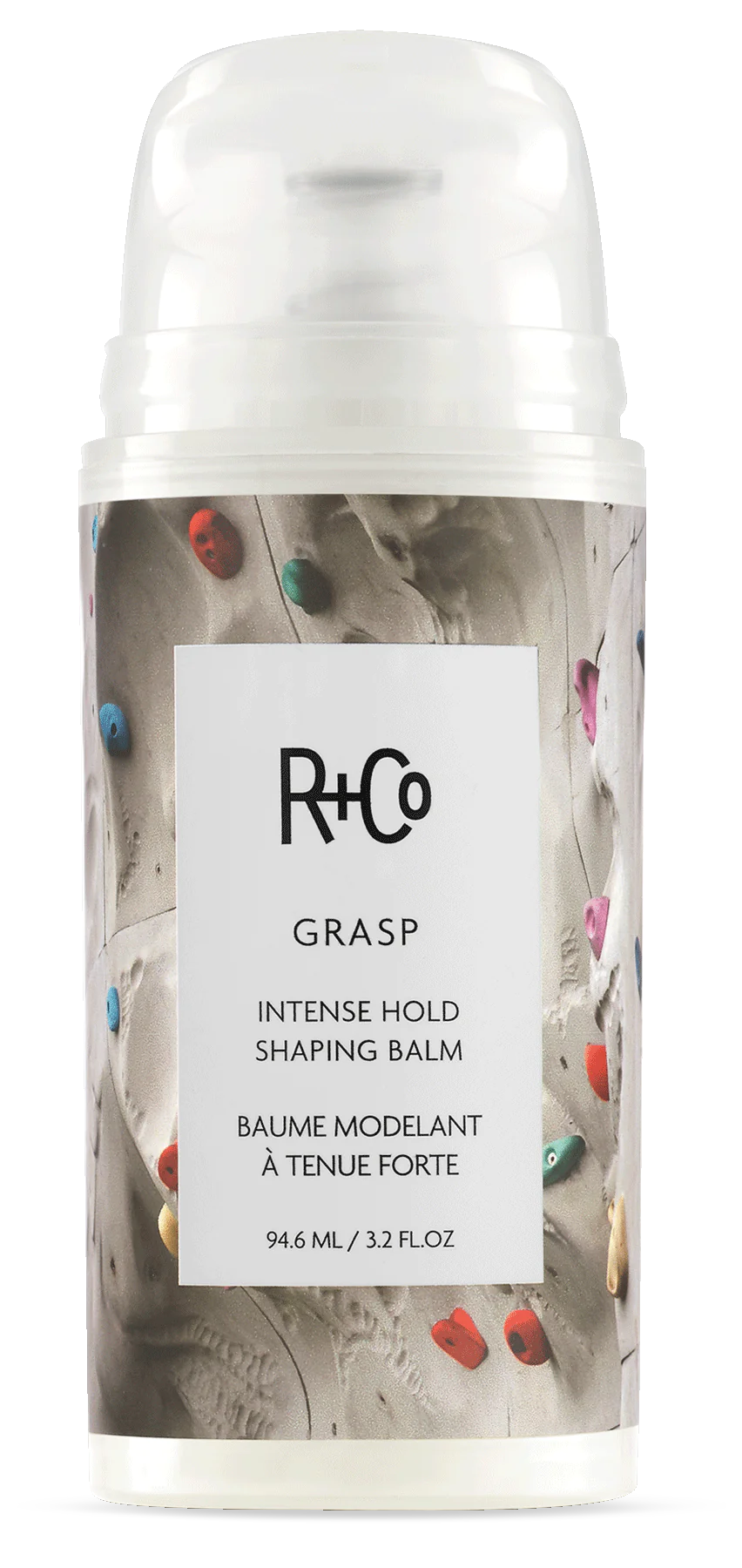 A container of R+Co Grasp Intense Hold Shaping Balm with a colorful background featuring multicolored confetti.