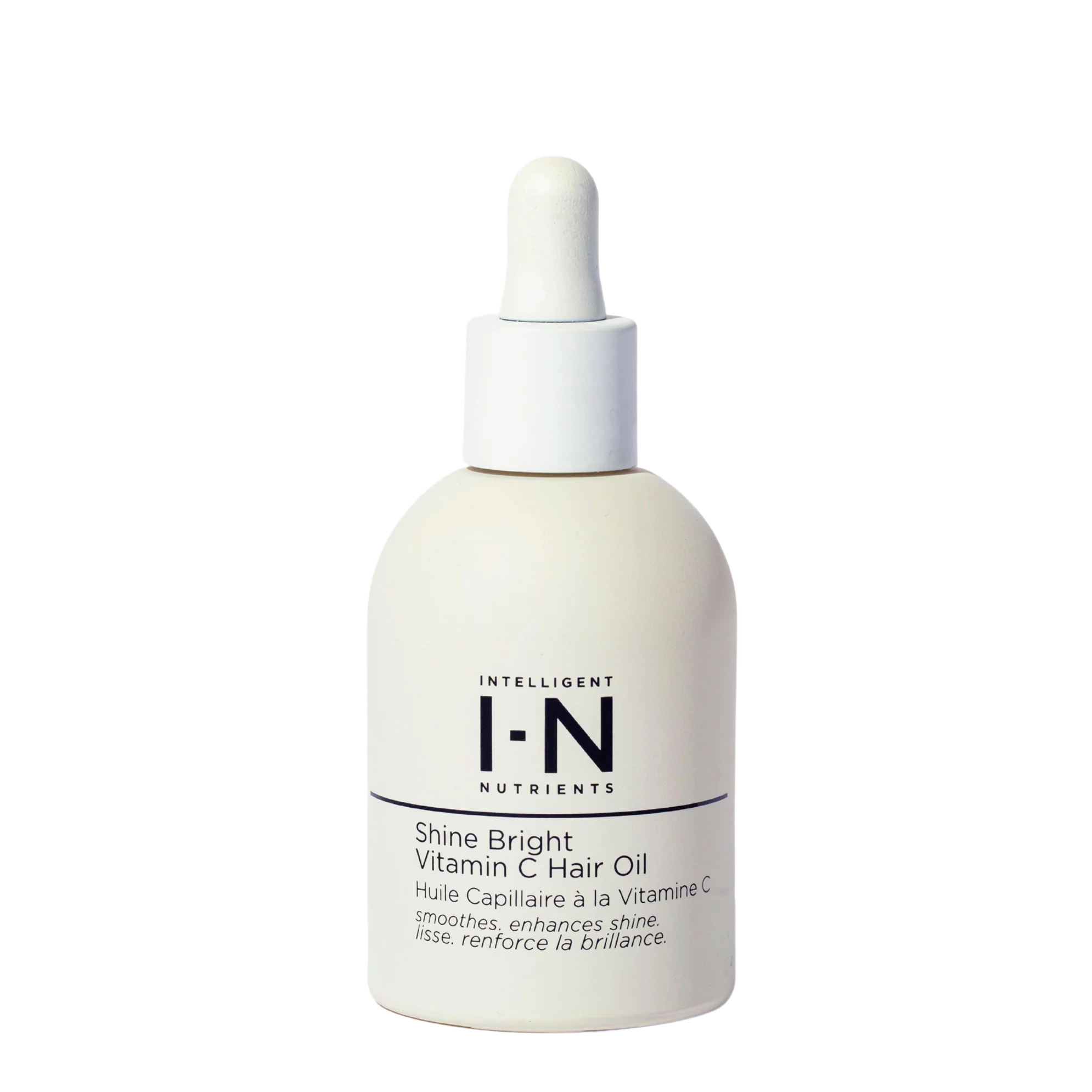 A bottle of Intelligent Nutrients Shine Bright Vitamin C Hair Oil with a white label and dropper.