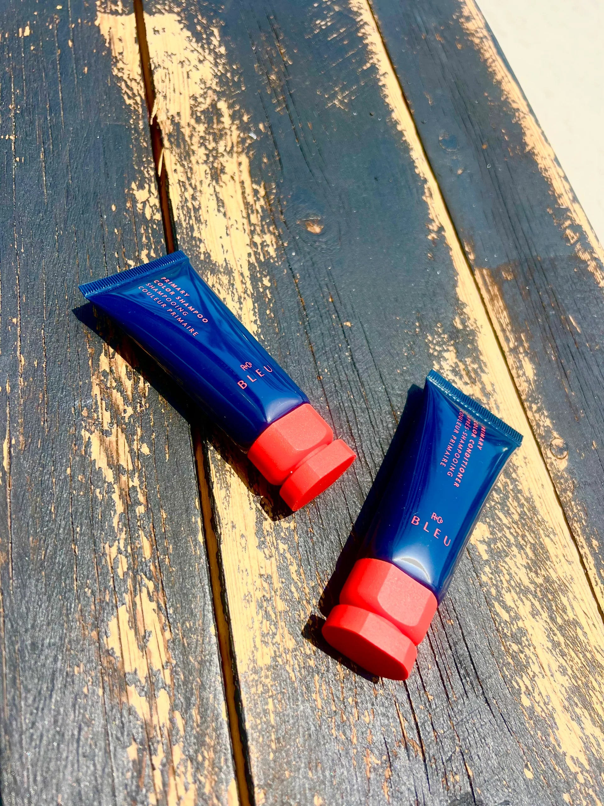 Two tubes on a wooden surface