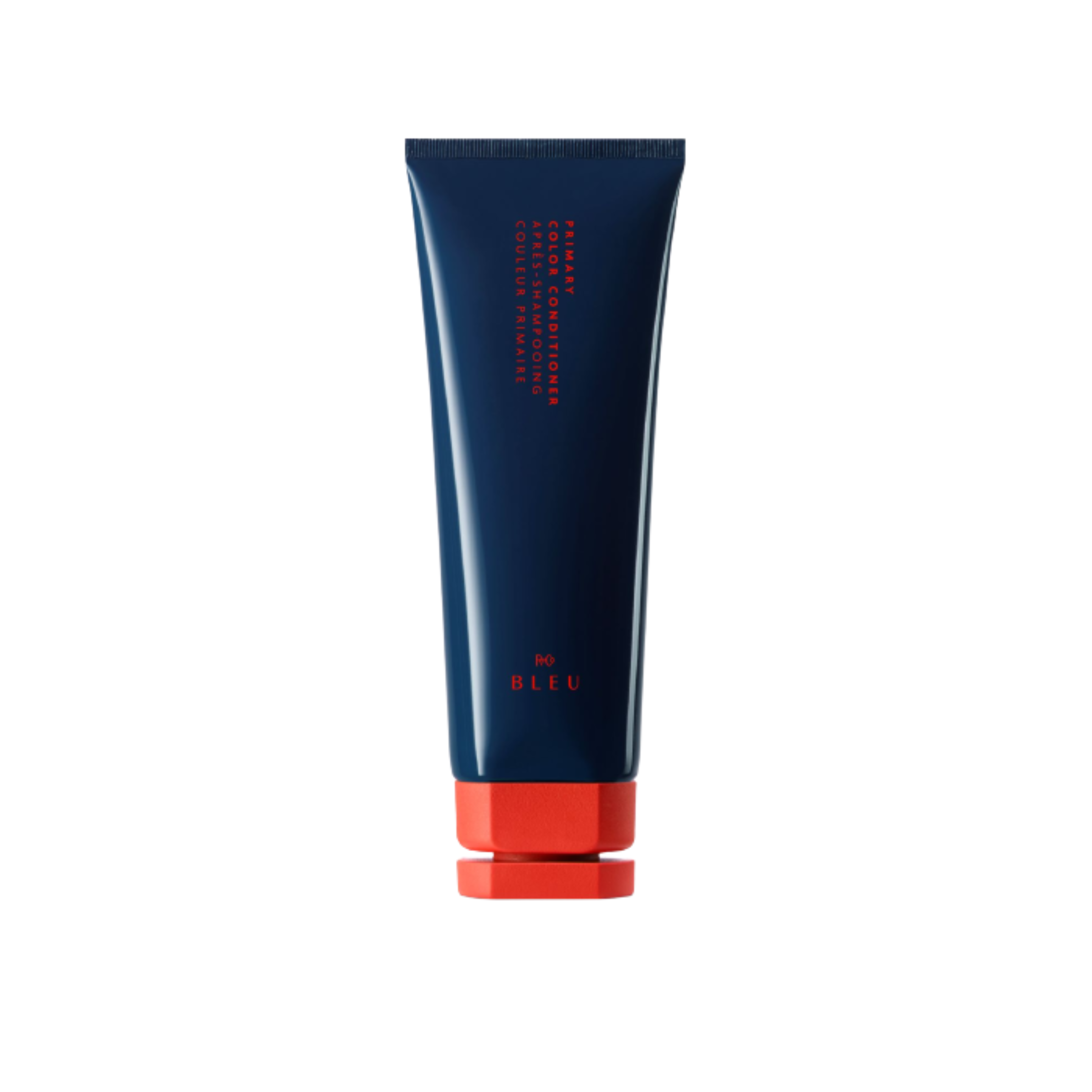 A tube of R+Co BLEU Primary Color Conditioner with blue and red packaging.