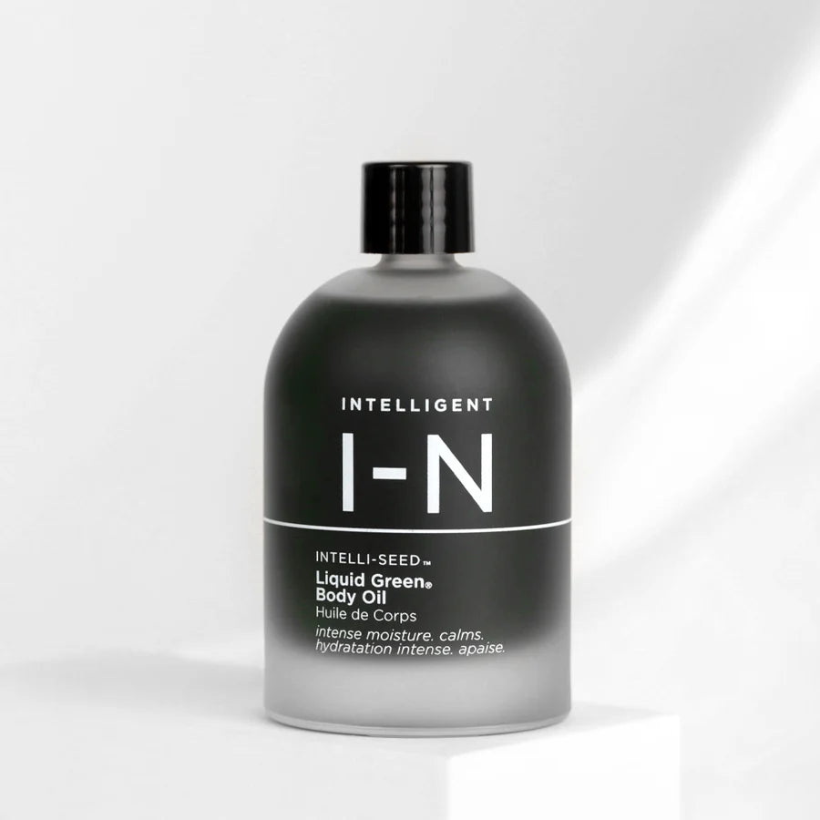 A bottle of Intelligent Nutrients Liquid Green Body Oil with a black cap and label.