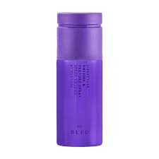 Purple tumbler of R+Co: Lifestyler Volume & Texture Spray on a white background
