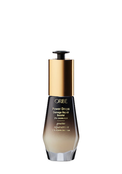 A bottle of Oribe Power Drops Damage Repair Booster, intensive damage repair serum for hair.