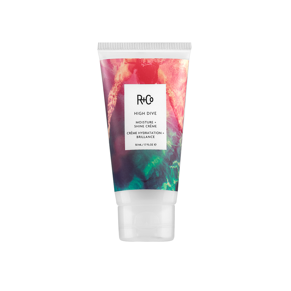 A tube of R+Co High Dive Moisture + Shine Creme with a colorful design.